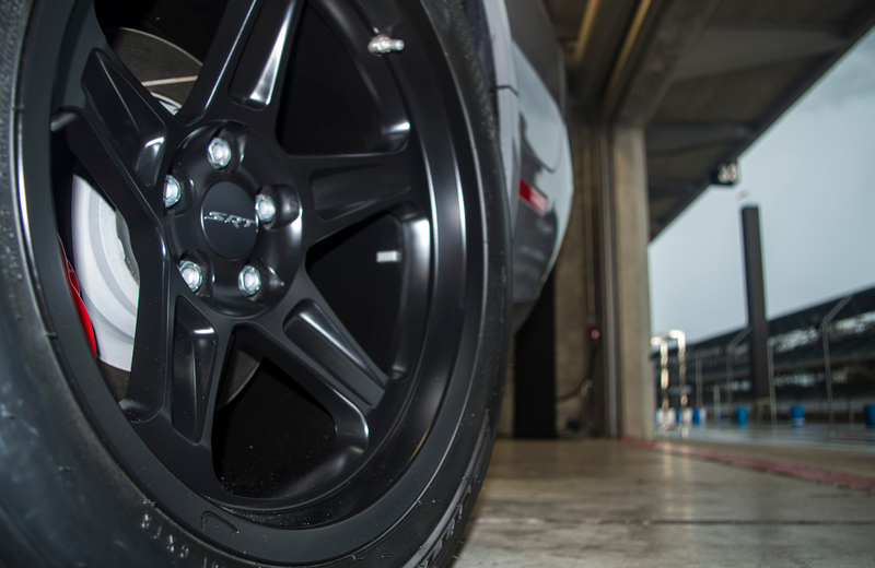 That little “devil tail” on the rim is for marking the tire to see if it moves under extreme stress. That, and it looks neat.